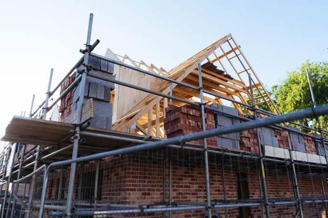 House under construction with exposed brickwork