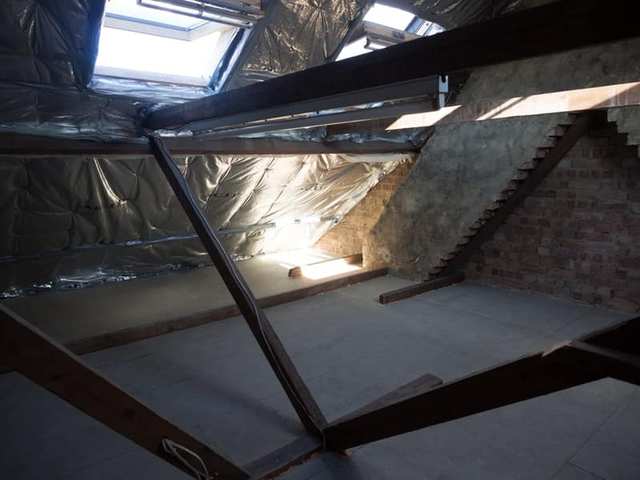 Attic room with exposed beams