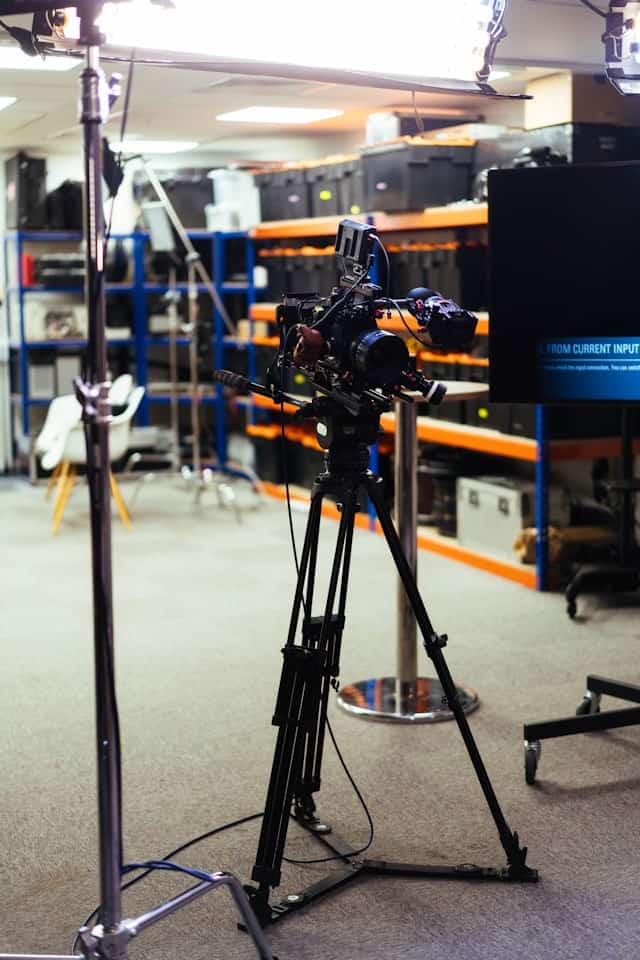 Video camera on a tripod in a studio